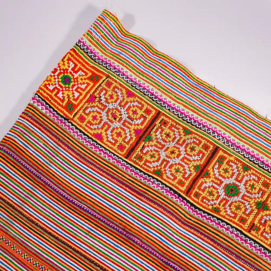 Vindigo orange cotton fabric roll with hand-stitched tribal embroidery front view