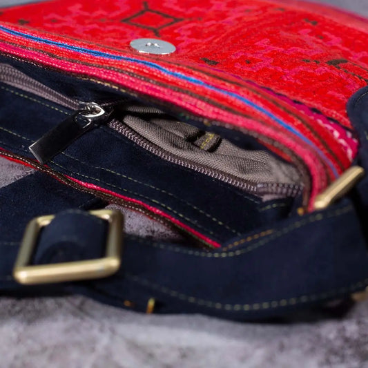 Vindigo red hemp crossbody bag zipper and strap detail with dark leather buckle