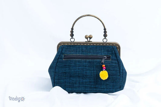 Vindigo blue handbag back view with zipper and tassel puller