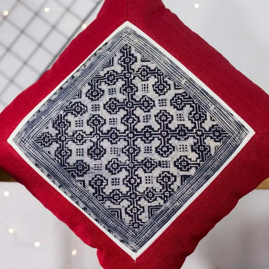 Vindigo red cushion cover close-up highlighting intricate H’mong batik handwork