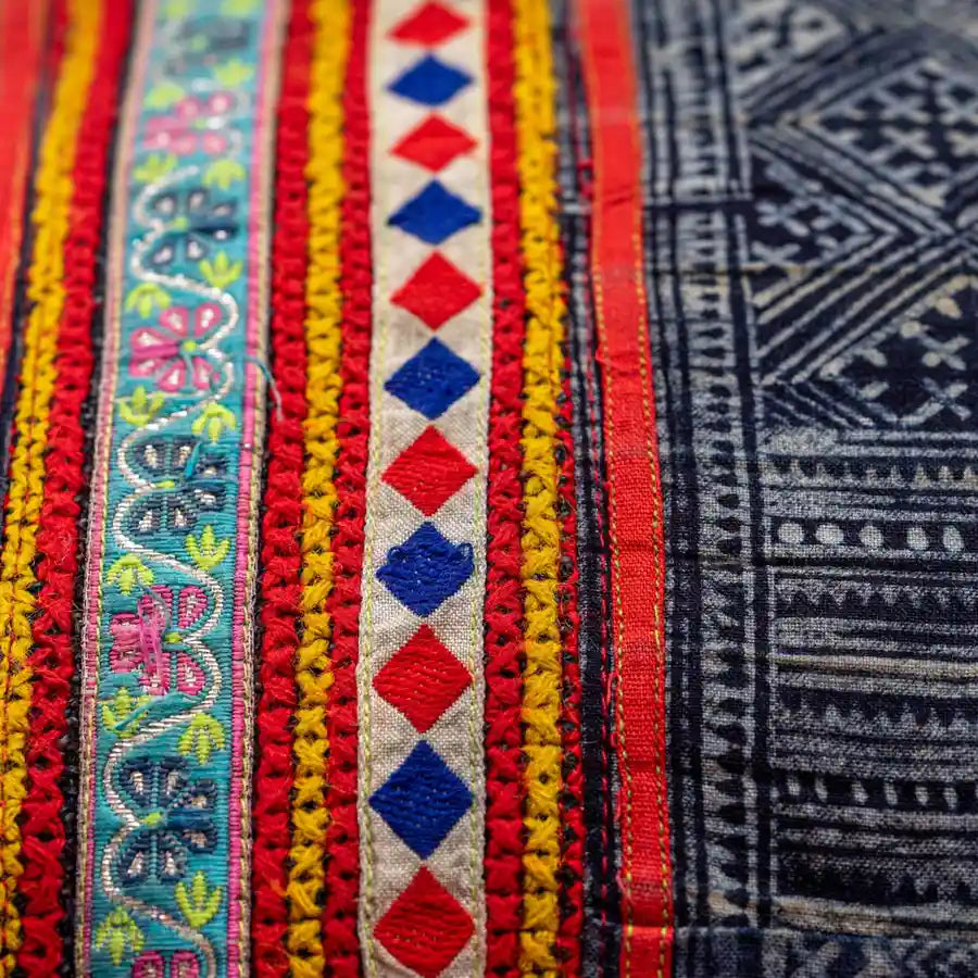 Vindigo cushion cover orange H’mong batik cross-stitch embroidery close-up