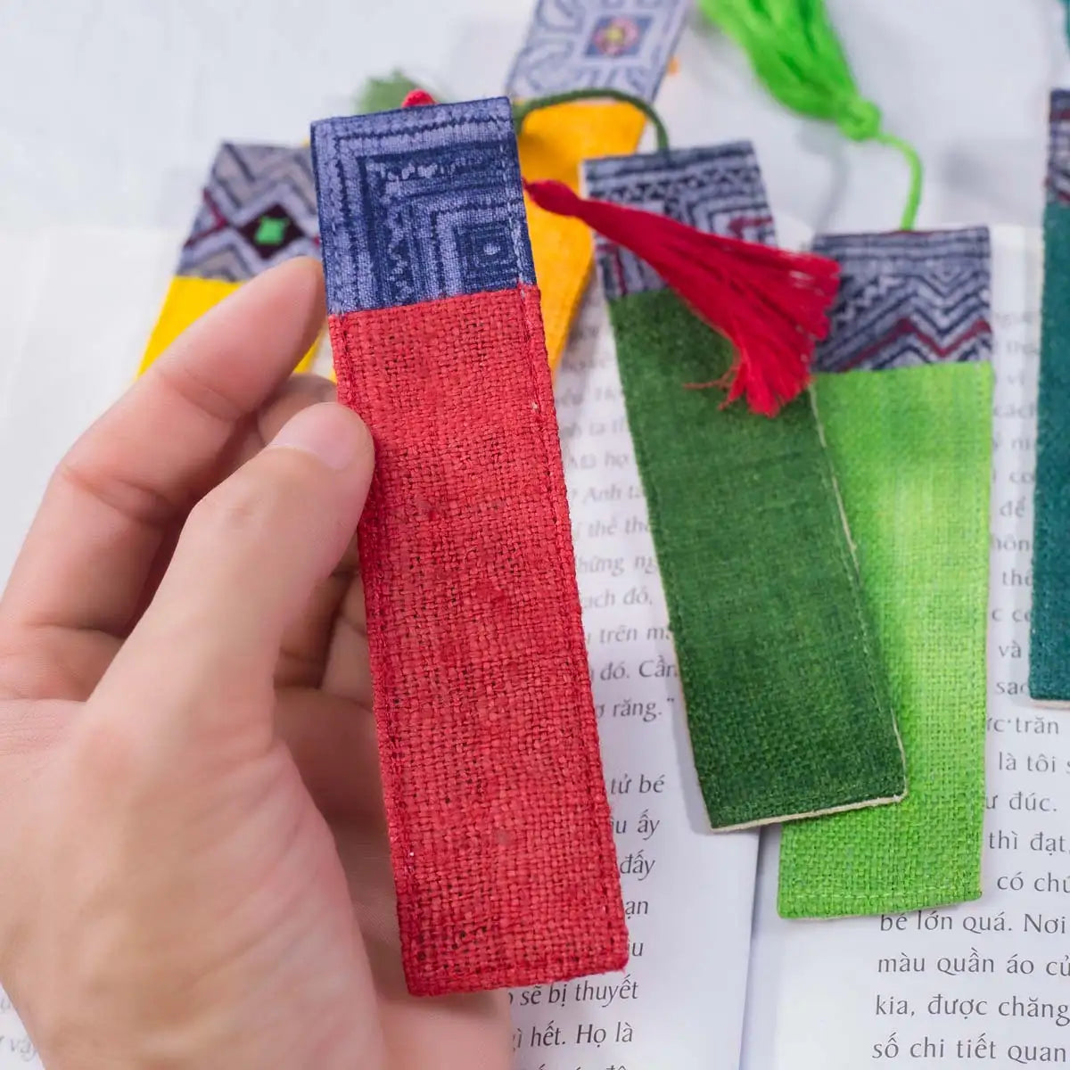Vindigo handmade red hemp batik pattern bookmark held in hand