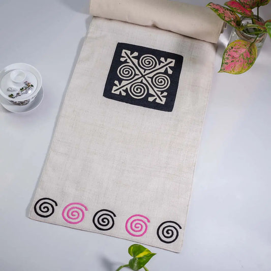 Vindigo beige hemp table runner full layout highlighting pink spiral border and central embroidery