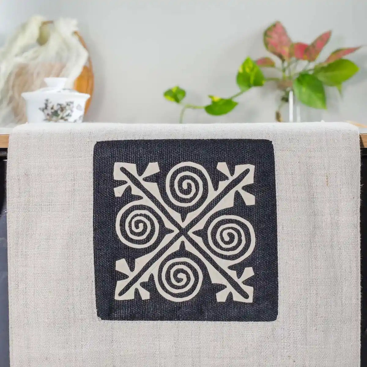 Vindigo beige hemp table runner full layout highlighting pink spiral border and central embroidery