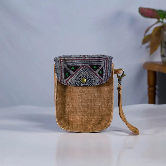 Front view of brown hemp flip phone belt bag with vintage patch, eco-friendly handmade design.