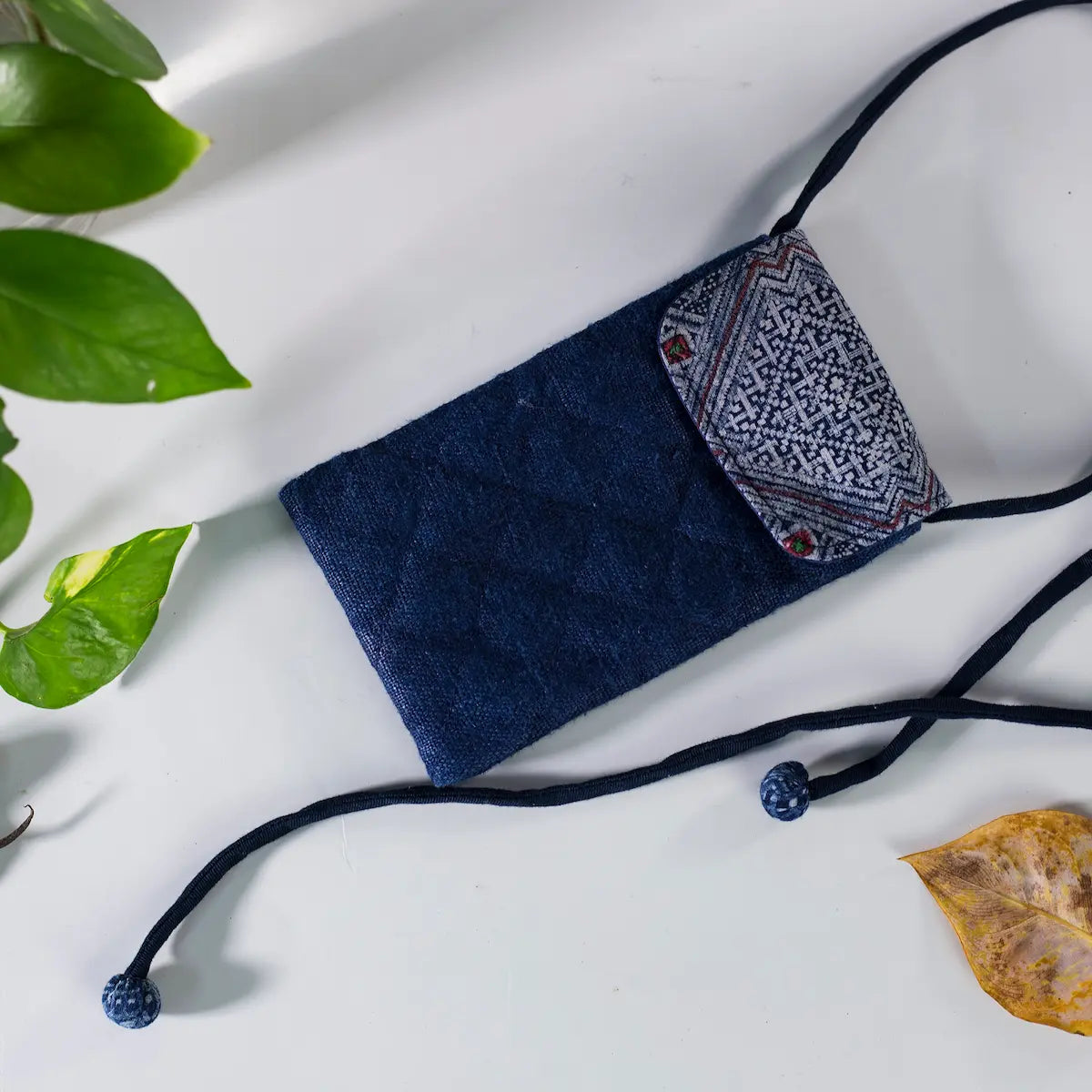 Indigo hemp mobilväska phone bag with open view, showing strap and H’mong patch detail.