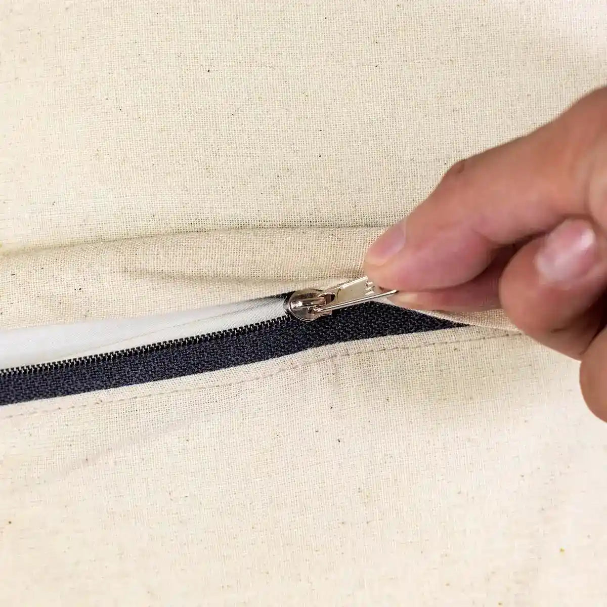 Vindigo cushion cover orange embroidered spiral zipper close-up