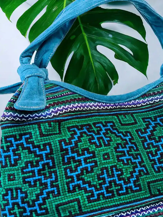 Vindigo handbag blue embroidered with orange lining side detail view