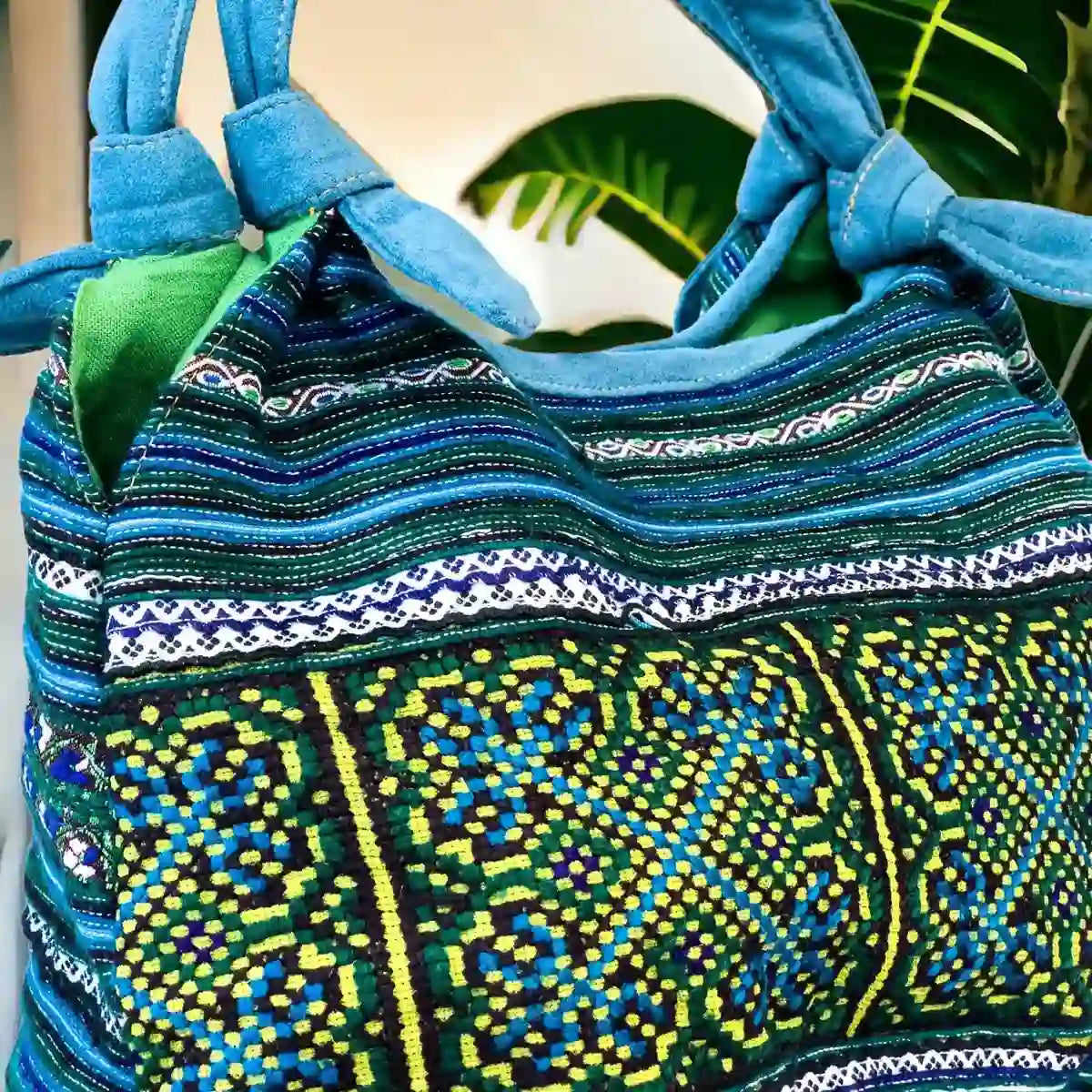 Vindigo handbag blue embroidered side detail view