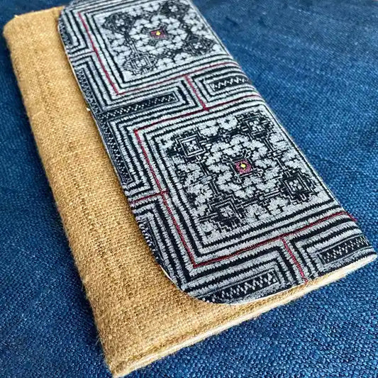 Vindigo long purse beige black embroidered angled side view