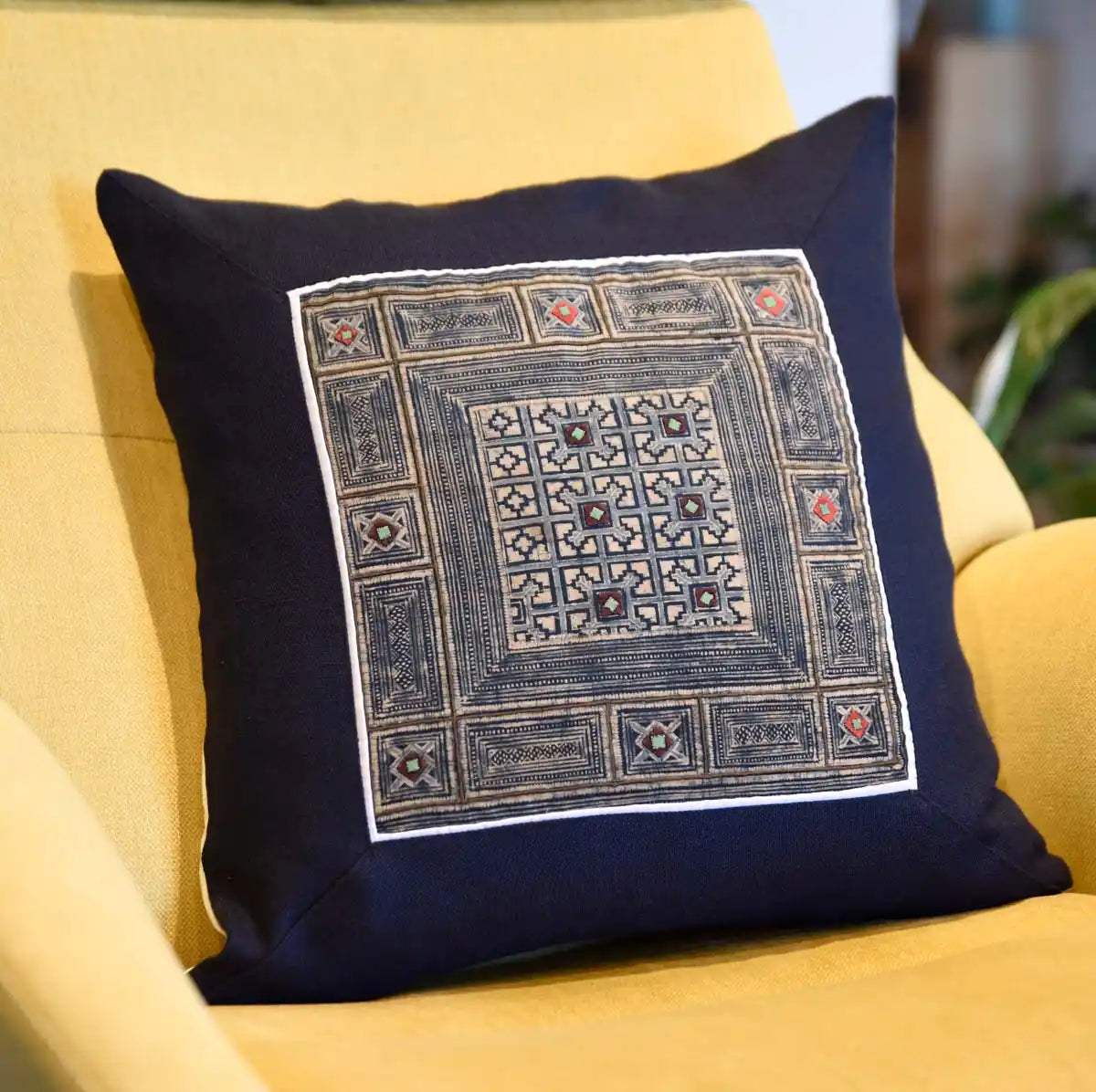 Vindigo indigo hemp cushion cover with tribal pattern on cozy chair