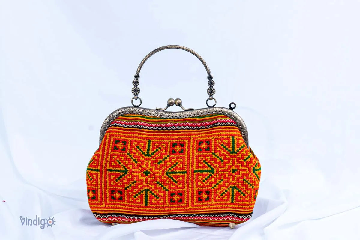 Vindigo orange hemp handbag with vintage cross-stitch embroidery front view