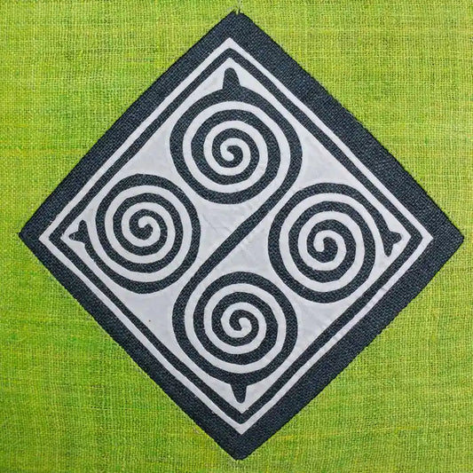 Vindigo green hemp cushion cover close-up of spiral embroidery