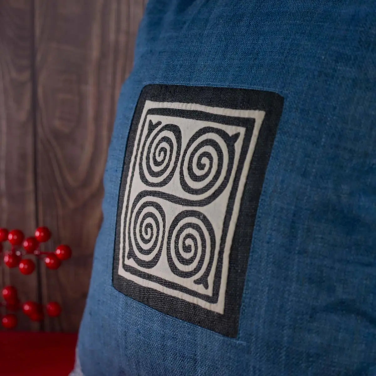 Vindigo blue hemp cushion cover with Hmong spiral embroidery front view