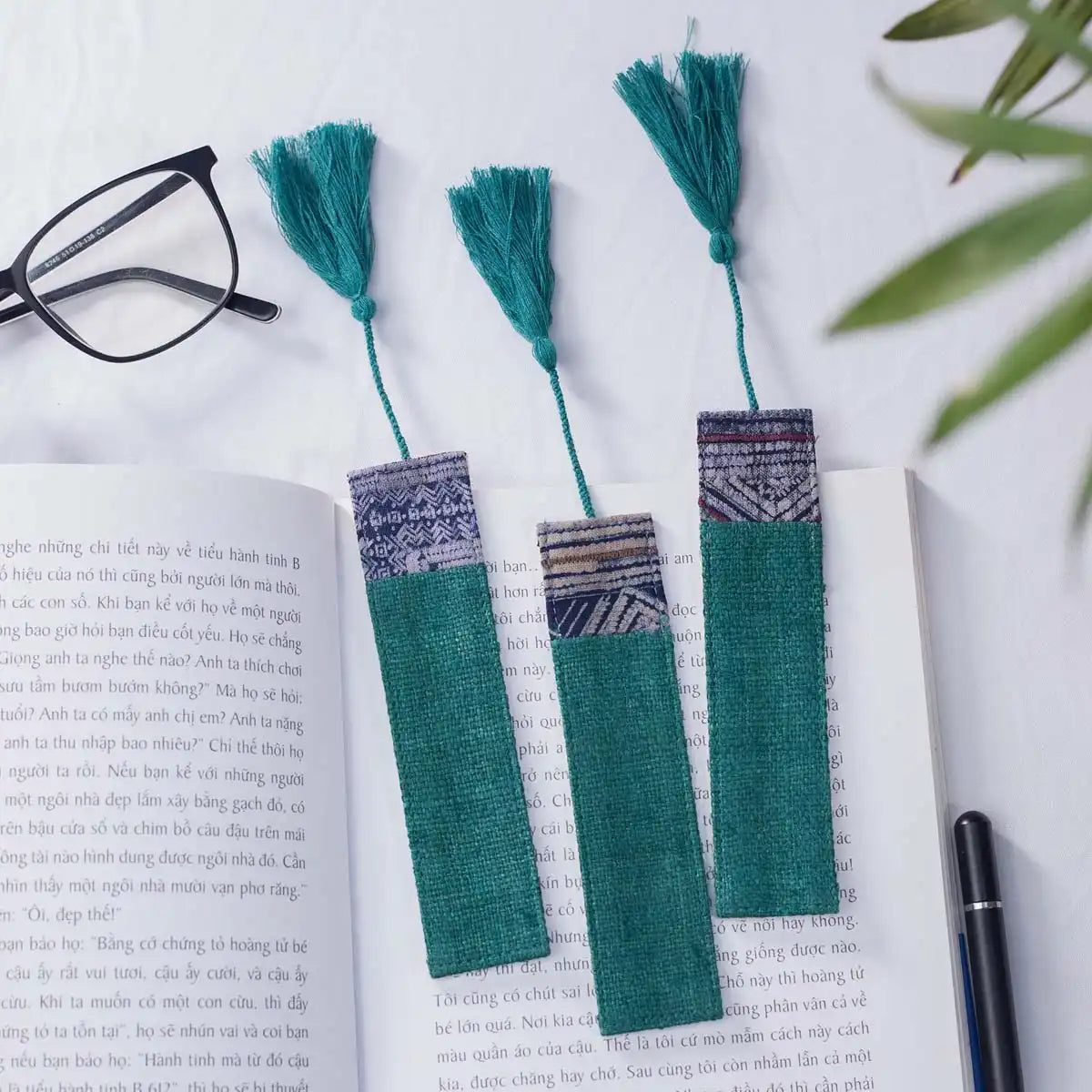 Vindigo teal hemp batik pattern bookmarks on open book