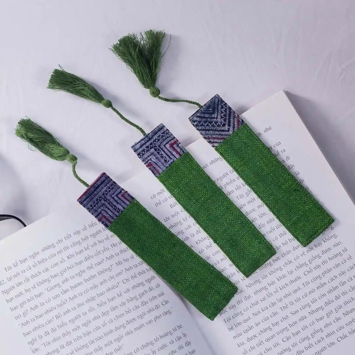 Vindigo green hemp bookmark with tribal pattern set on book