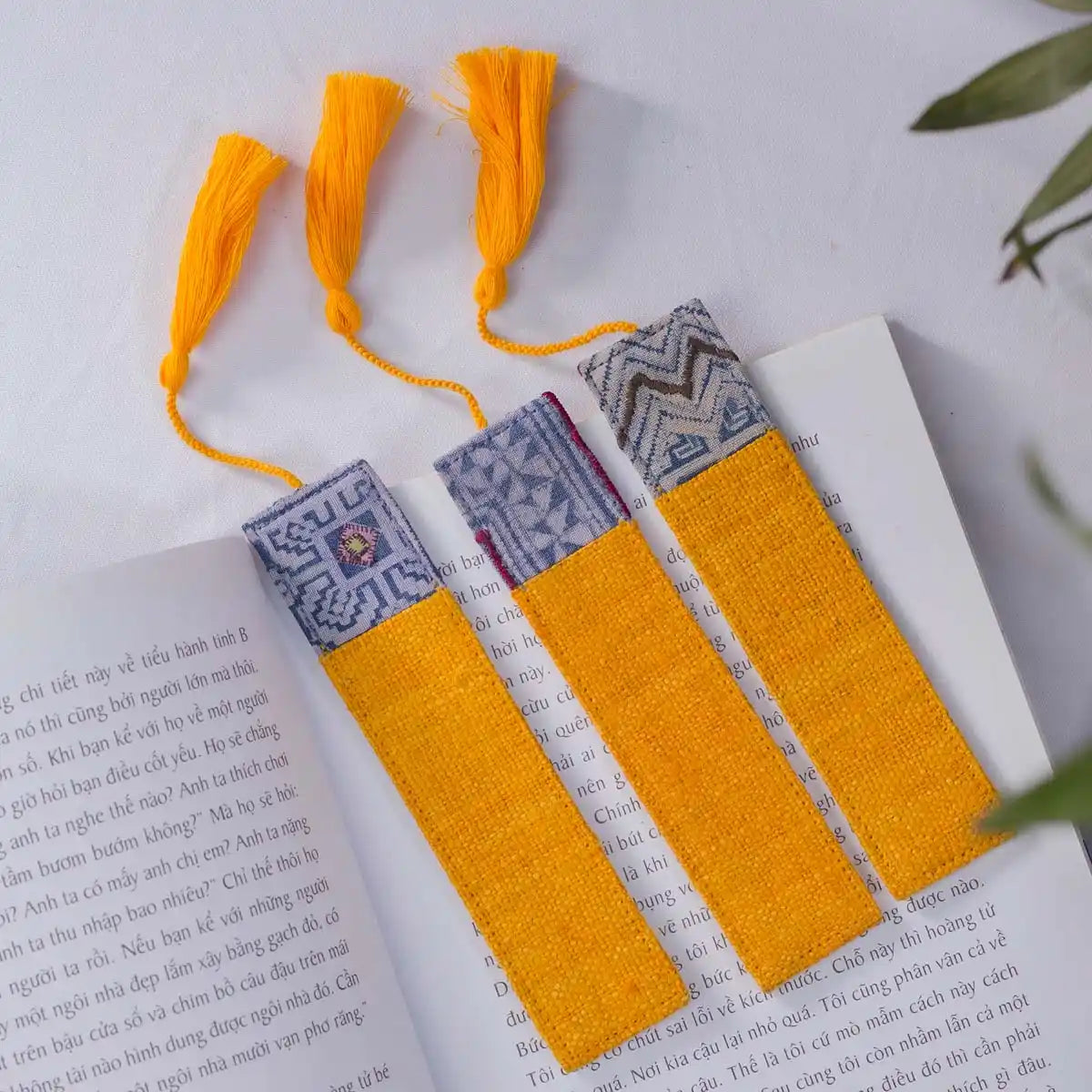 Vindigo yellow hemp tribal pattern bookmarks on open book