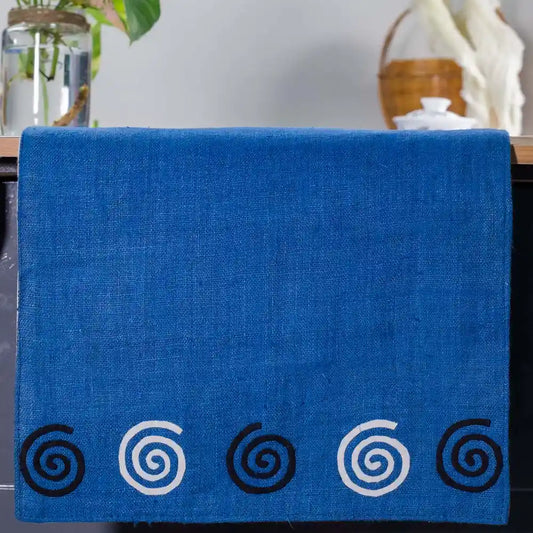 Vindigo blue hemp table runner end view with alternating white and black spiral motifs