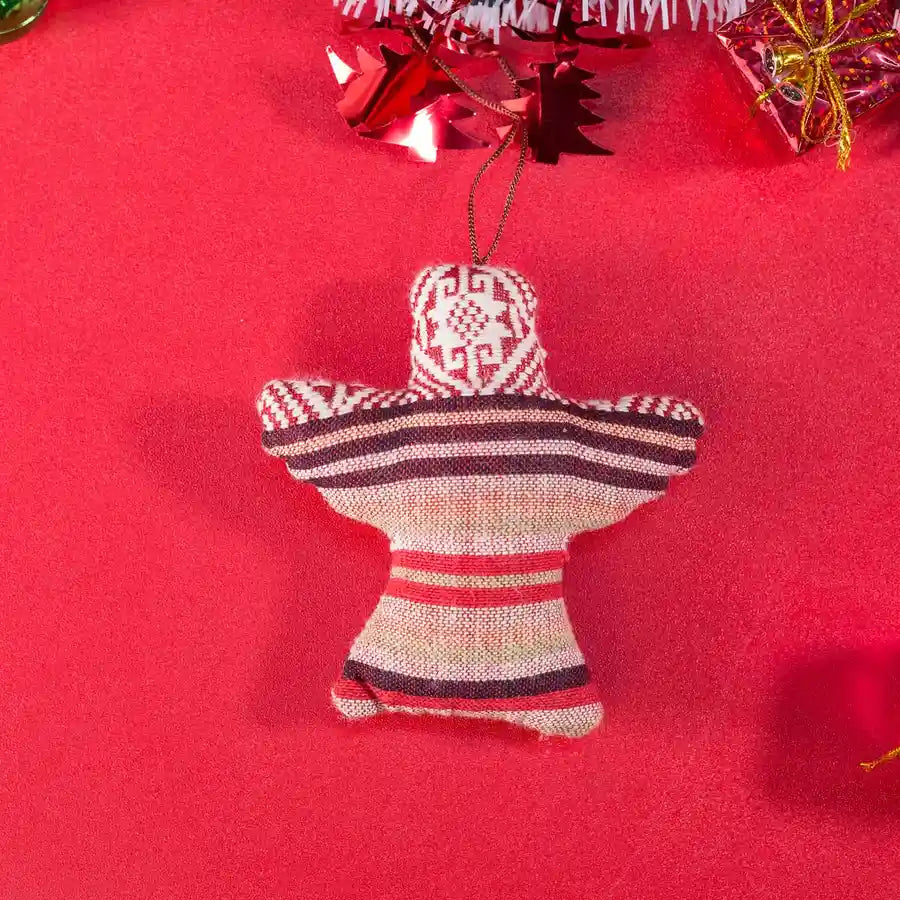 Vindigo red tribal embroidered bell-shaped Christmas ornament on red background
