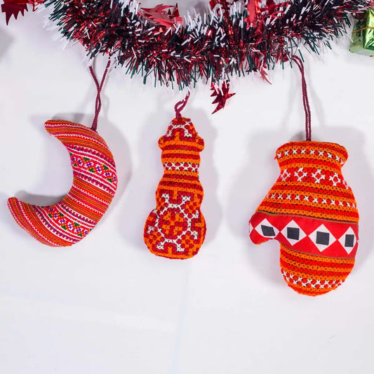 Vindigo red tribal embroidered Christmas ornaments hanging under garland