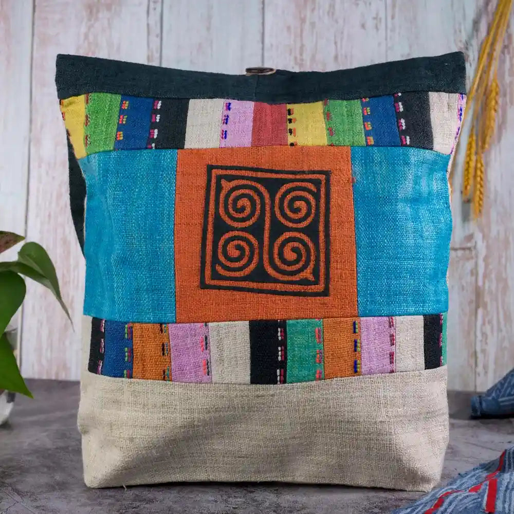 Vindigo shoulder bag teal hemp with orange spiral patch front view