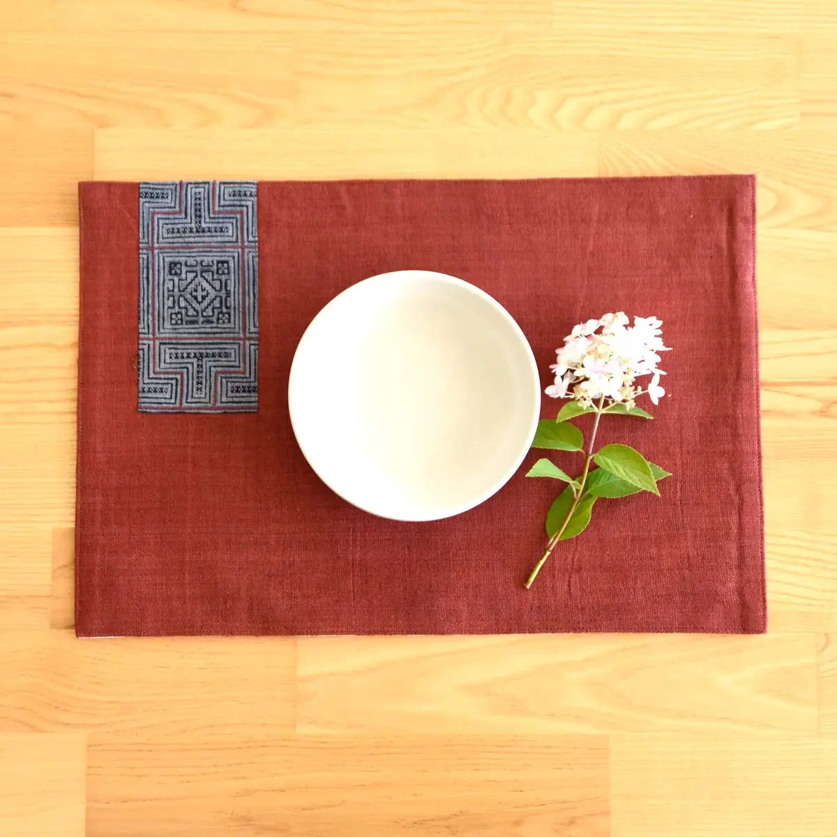 Vindigo burgundy hemp placemat with indigo napkin and bowl