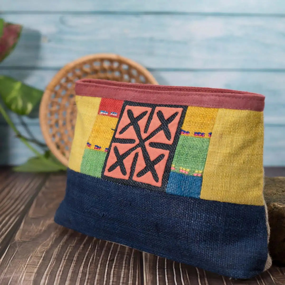 Vindigo hemp cosmetic bag with multicolor embroidered H’mong motif front view