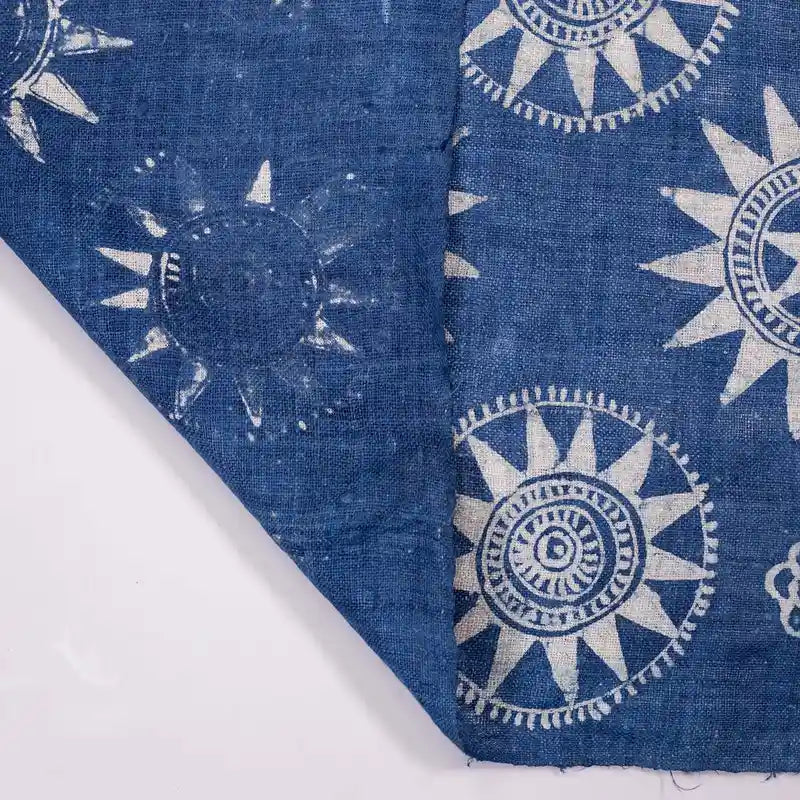 Vindigo indigo fabric roll with sunflower motif, folded corner view