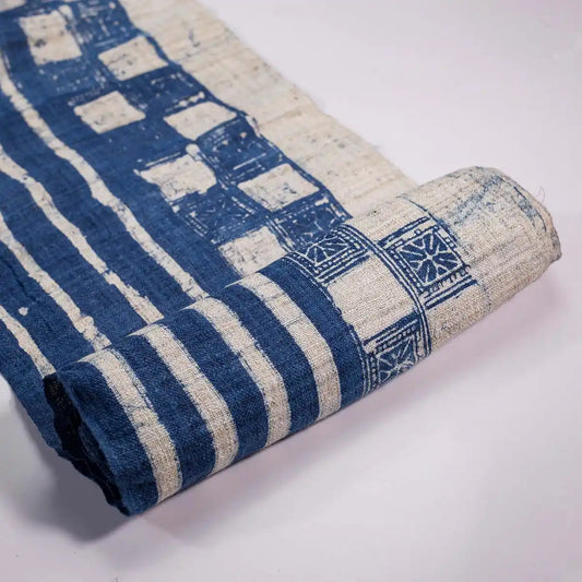 Vindigo indigo fabric roll with block striped check pattern, partially rolled