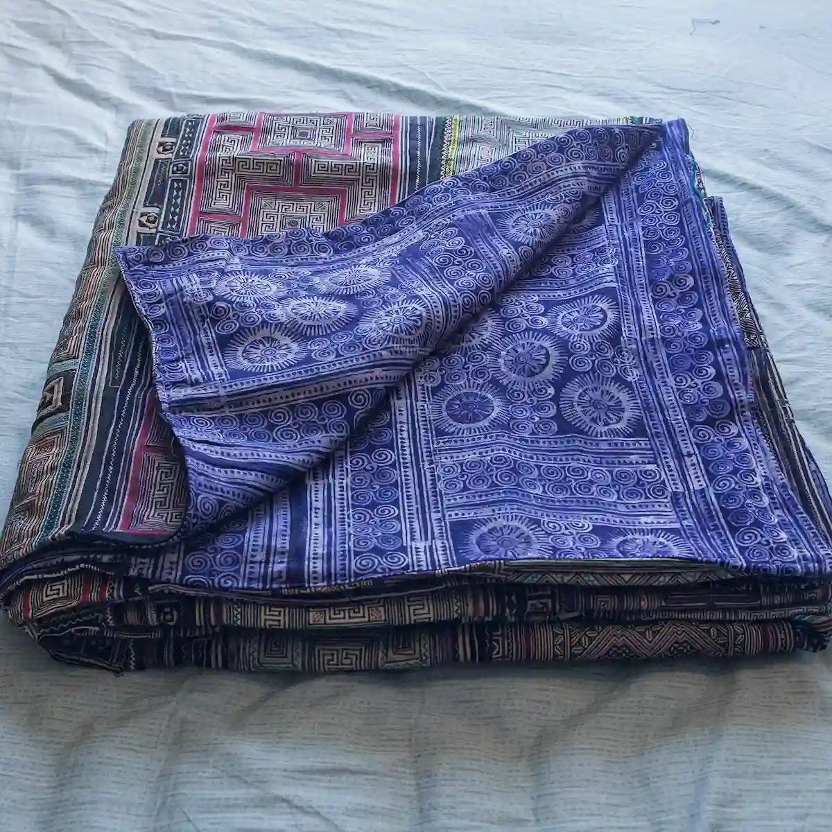 Vindigo purple cotton bed cover with hand-drawn batik folded view