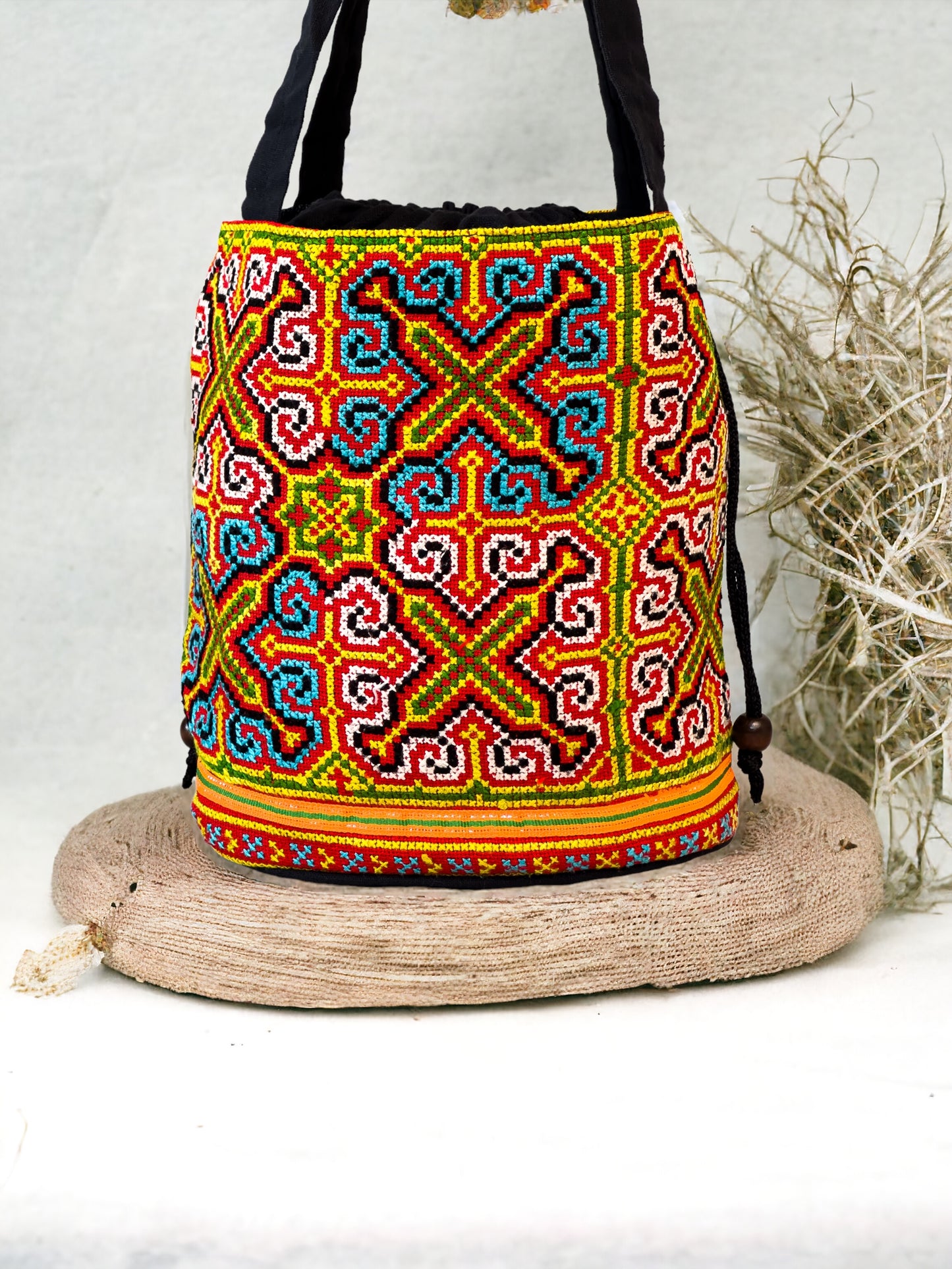 Neon blue and yellow embroidery shoulder bag with string to close