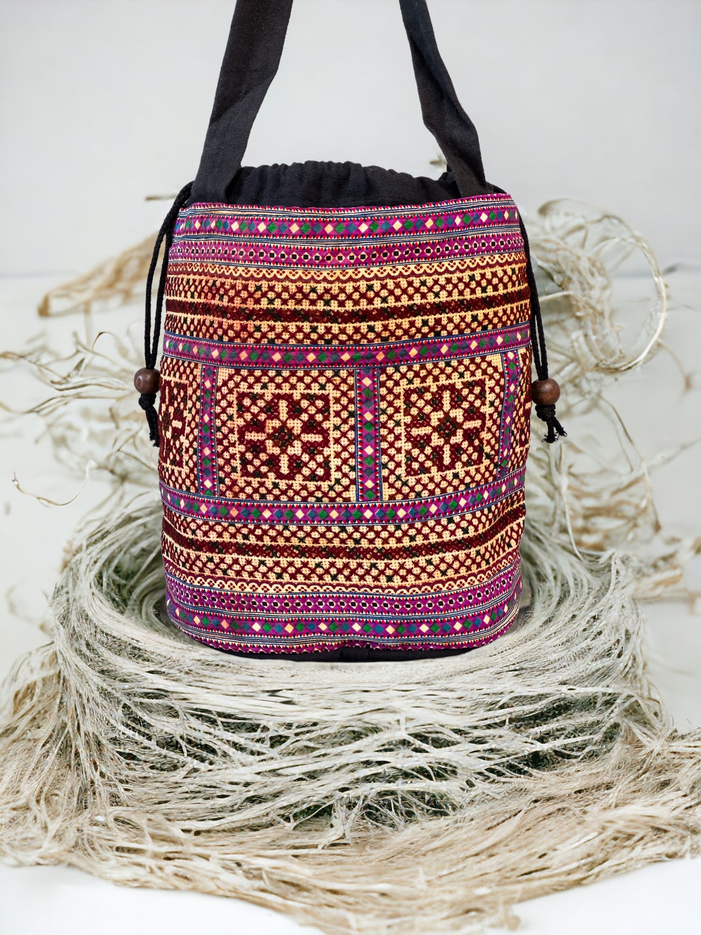 Brown and purple embroidery shoulder bag with string to close
