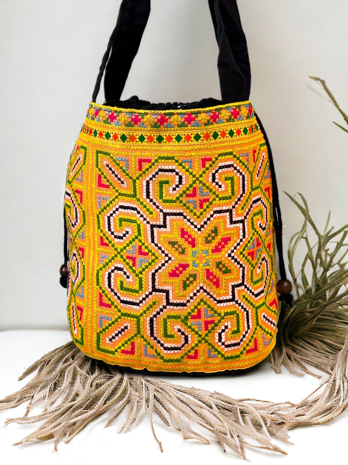 Yellow and blue embroidery shoulder bag with string to close