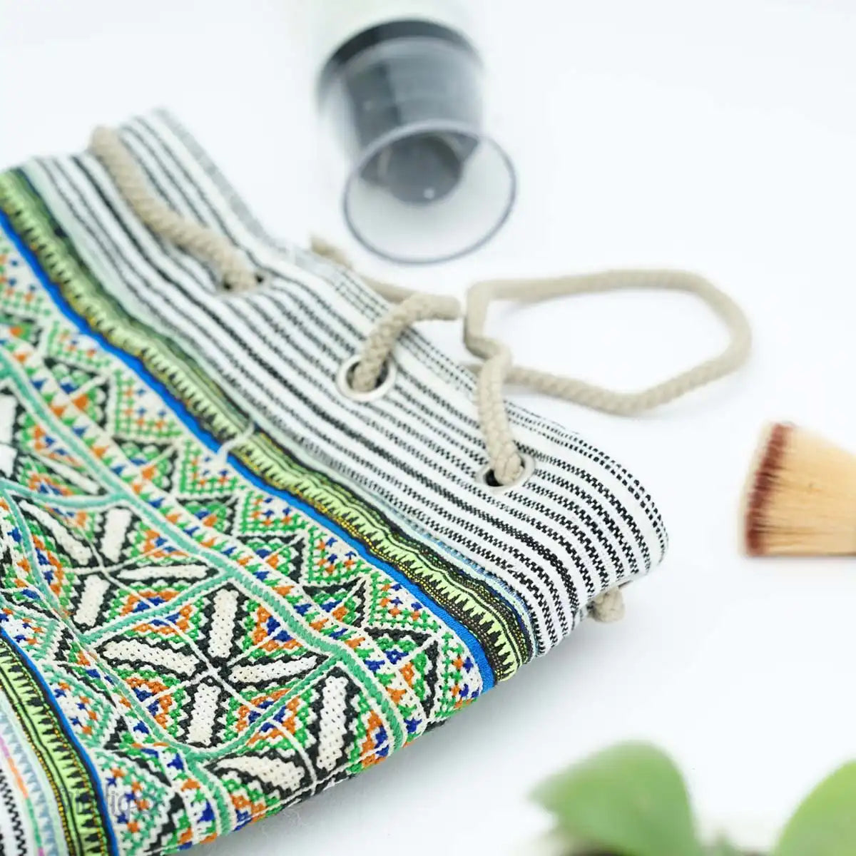 Vindigo tribal pouch with green embroidery and drawstring close-up