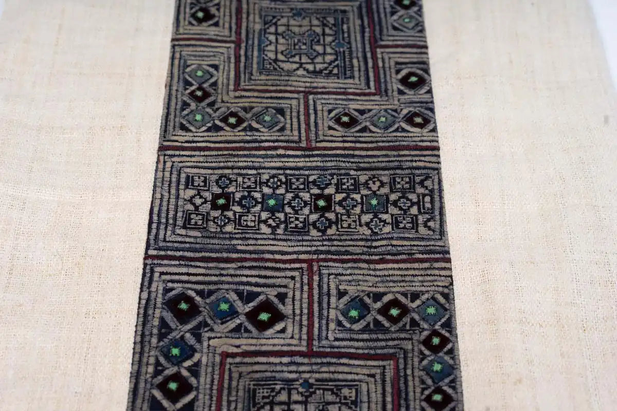 Decorative indigo embroidered strip from handmade hemp cushion cover