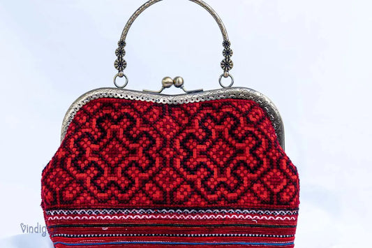 Vindigo vintage red embroidered handbag with copper frame front angle