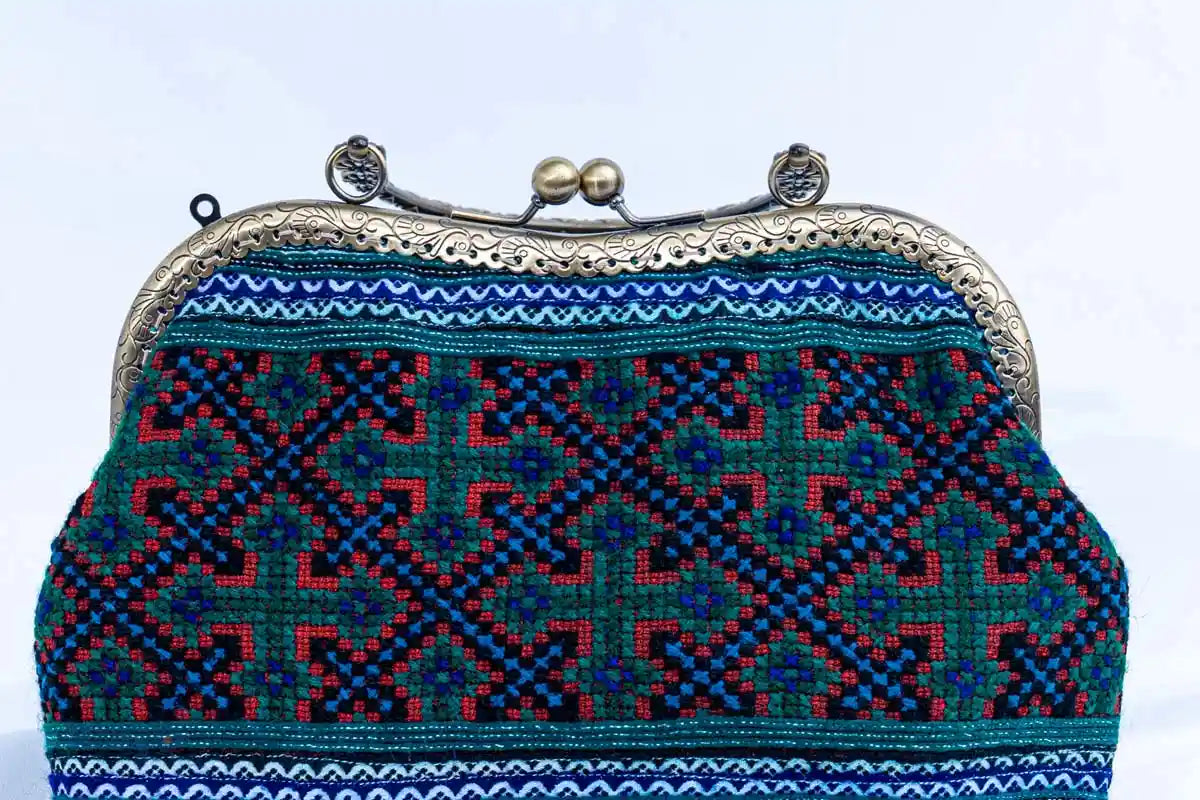 Vindigo handbag close-up of cross-stitch embroidery and metal clasp