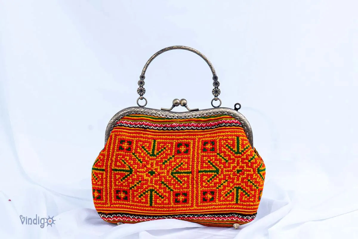 Vindigo handmade handbag with H’mong embroidery and copper frame front view
