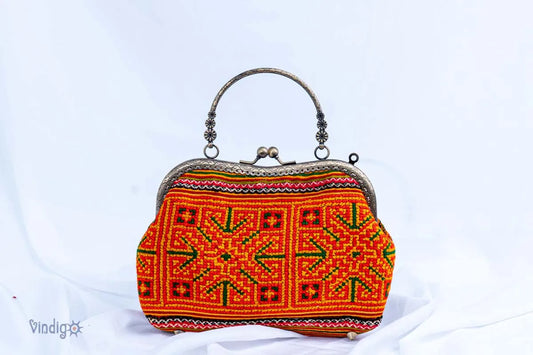 Vindigo handmade handbag with H’mong embroidery and copper frame front view