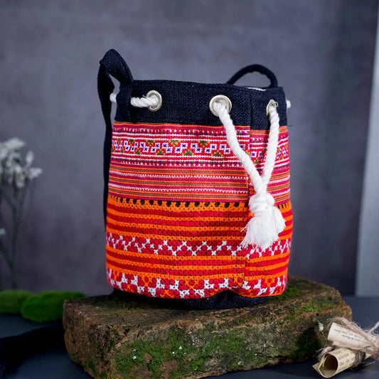 Vindigo orange hemp tribal embroidered bucket bag side angle view