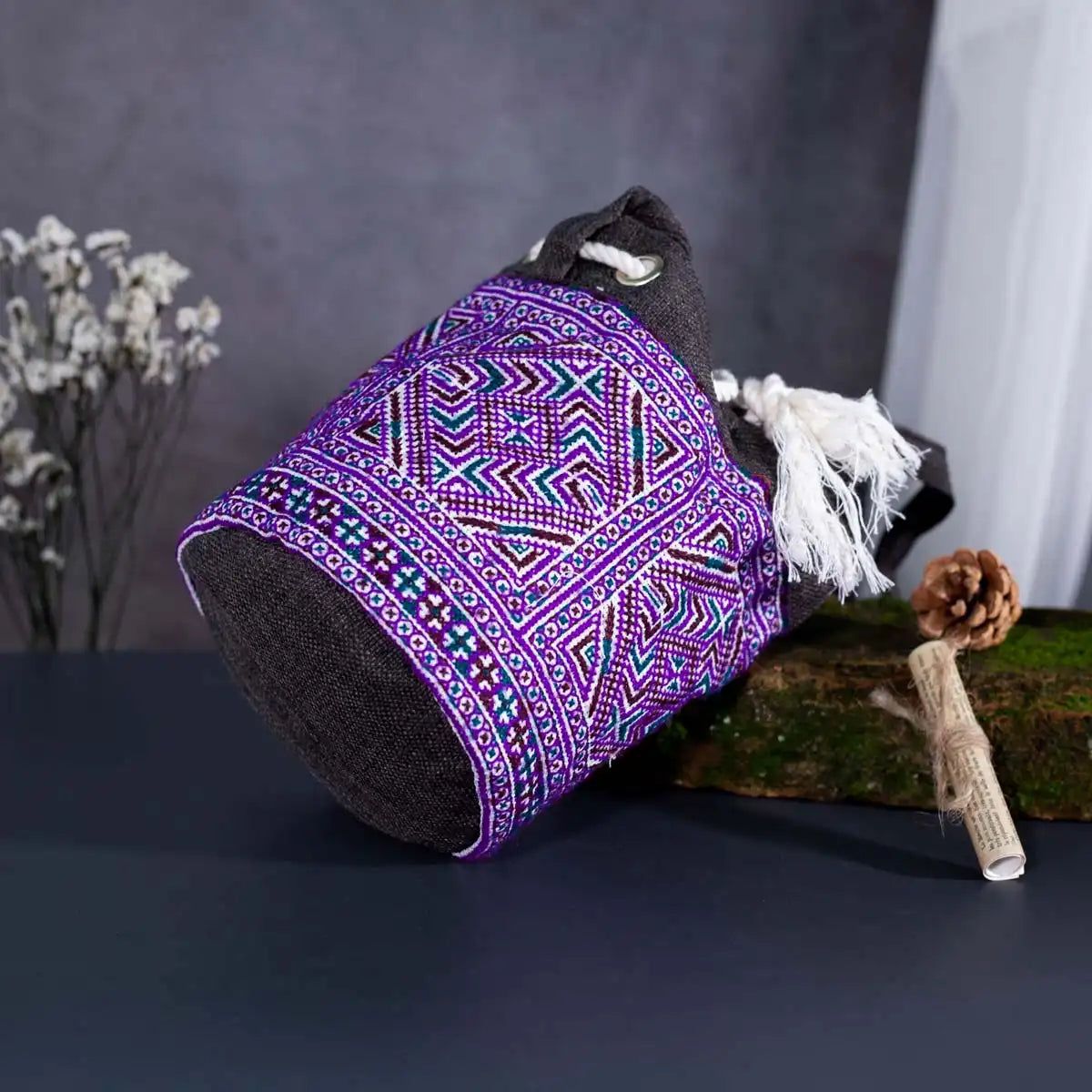 Bottom view of Vindigo purple hemp floral embroidered bucket bag