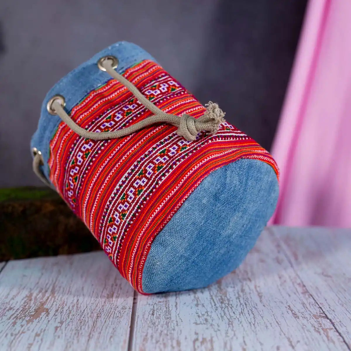 Vindigo red embroidered canvas bucket bag bottom angle view