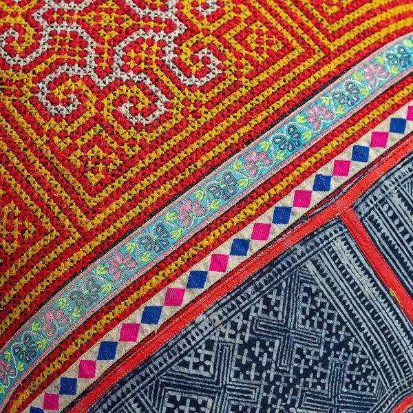 Vindigo cushion cover orange H’mong batik embroidery close-up