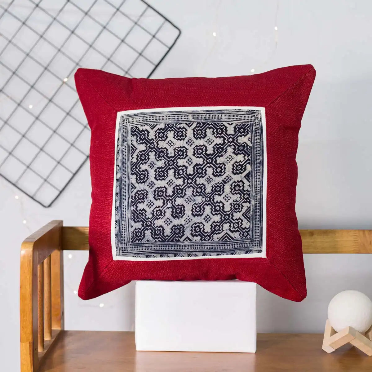 Vindigo red canvas cushion cover front view with black and white H’mong batik embroidery