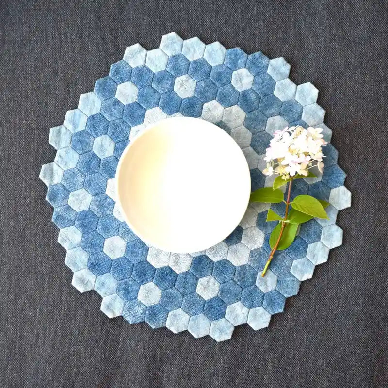 Handcrafted blue denim hexagon placemat under white bowl