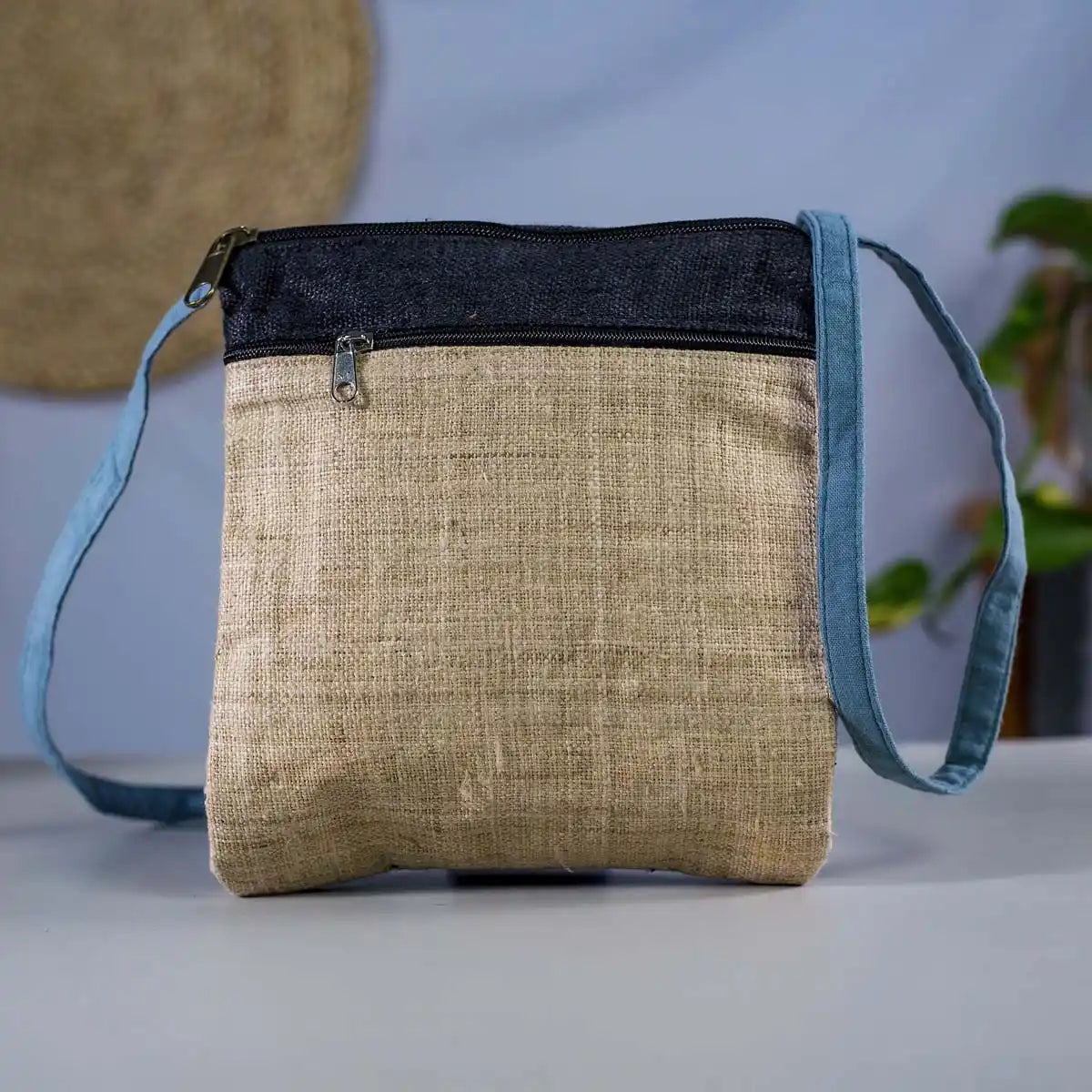 Vindigo beige and blue hemp crossbody bag back view with zipper pocket