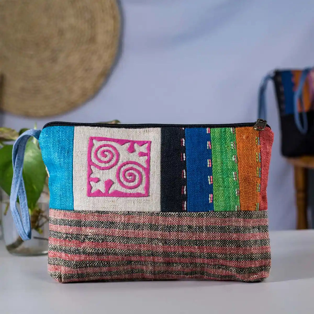 Vindigo colorful hemp cosmetic bag front close-up showing pink H’mong motif