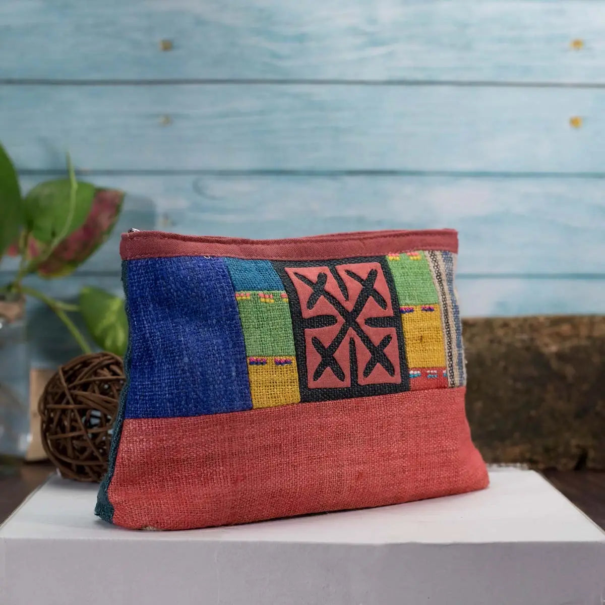 Vindigo hemp cosmetic bag front close-up with red base and patchwork design