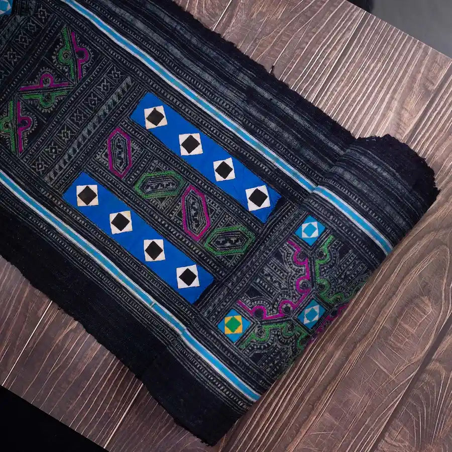 Vindigo black Hmong fabric with diamond panel embroidery, flat layout