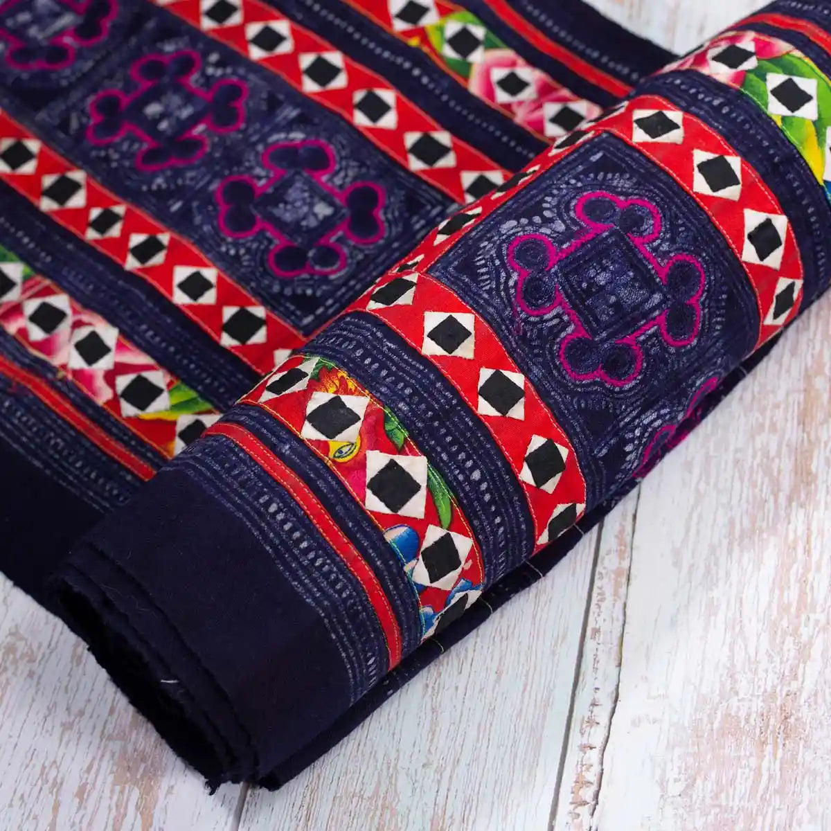 Vindigo black tribal fabric roll with hand embroidery partially rolled
